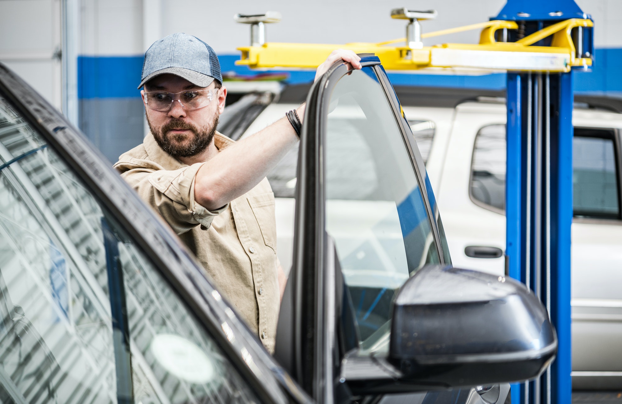 Working Caucasian Auto Service Technician